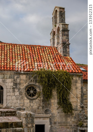 Photo of Santa Maria in Punta, one of the oldest buildings in Budva, Montenegro, located in the historic Old Town. Highlights medieval architecture, stone walls, and the charm of the coastal 133912315