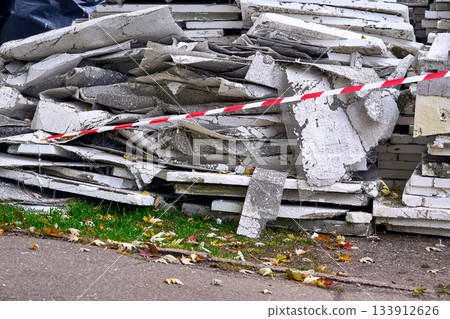 Old insulation material removed from walls.Fenced red tape 133912626