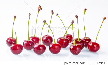Side view of juicy ripe cherries on a clean white background for stock photos Side view of juicy ripe cherries on a clean white background for stock photos 133912941