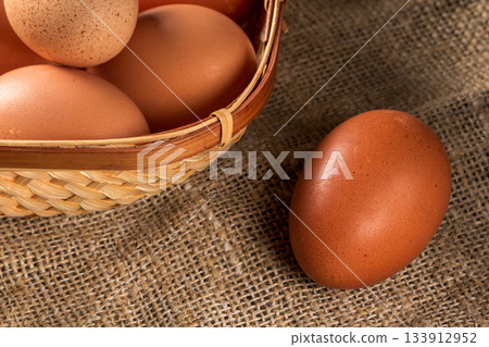 Delicious eco-friendly chicken eggs from a home farm on rustic wood table 133912952