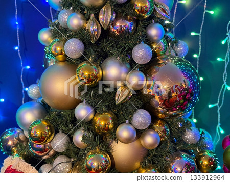 Christmas ornament tree shimmering in festive glow. Holiday warmth, winter celebration and family joy, home atmosphere, sparkling magic and seasonal cheer create nostalgic Christmas mood. Christmas ornament tree shimmering in festive glow. Holiday warmth, winter celebration and family joy, home atmosphere, sparkling magic and seasonal cheer create nostalgic Christmas mood. 133912964