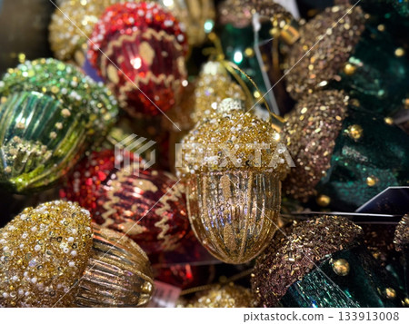 Sparkling acorn ornaments in vibrant christmas collection. Seasonal wonder through festive craft, joyful color, winter tradition, magical decor, warm celebration and creative holiday expression. 133913008