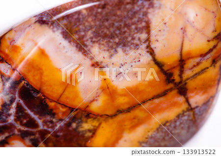 Macro mineral stone jasper "bird's eye" on white background 133913522