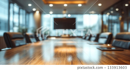 Blurred Conference Room with Wooden Table, Chairs, and Screen 133913603