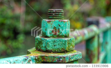 Rusted Bolt and Nut on Weathered Metal Railing 133913906