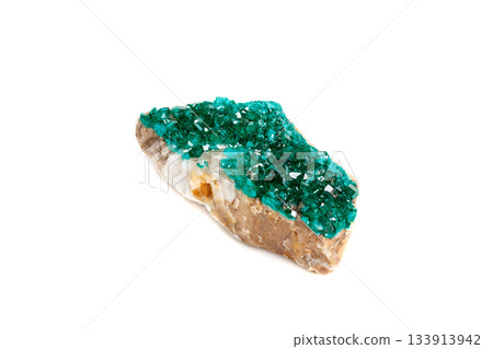 Macro mineral stone Dioptase silicate copper on a white background Macro mineral stone Dioptase silicate copper on a white background 133913942