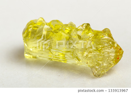 Macro mineral beryl heliodor stone on white background Macro mineral beryl heliodor stone on white background 133913967