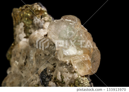 Macro of a mineral stone Sphalerite with fluorite and pyrite on a black background 133913970