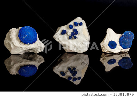 Macro mineral stone Azurite in siltstone against black background 133913979
