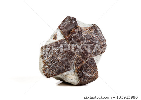 Macro mineral stone Staurolite on a white background 133913980