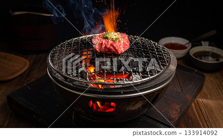 Grilling Wagyu Beef on Japanese BBQ Grill with Flames 133914092