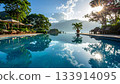 Infinity Pool Overlooking Mountains at Luxury Resort 133914095