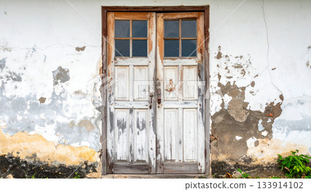 Weathered Double Doors in Old Building Facade Weathered Double Doors in Old Building Facade 133914102