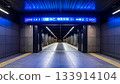Modern Subway Station Platform with Blue Signage 133914104