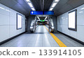 Empty Subway Station with Escalators and Signage 133914105