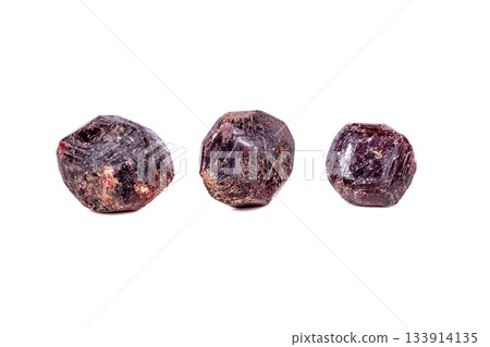 Macro of a mineral garnet stone on a white background Macro of a mineral garnet stone on a white background 133914135