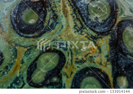 Macro mineral stone jasper kambaba on a white background 133914144