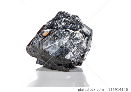 macro mineral stone sherle, schorl, black tourmaline on white background macro mineral stone sherle, schorl, black tourmaline on white background 133914146