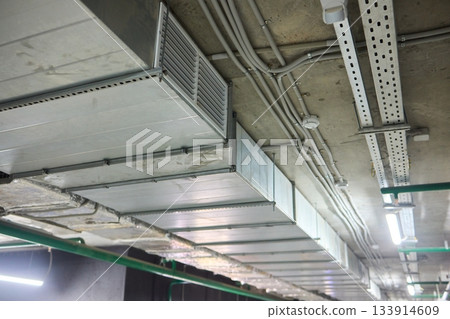Subterranean parking details, Basement parking area equipped with lighting and plumbing, Underground vehicle shelter featuring electrical wiring and ventilation systems Subterranean parking details, Basement parking area equipped with lighting and plumbing, Underground vehicle shelter featuring electrical wiring and ventilation systems 133914609