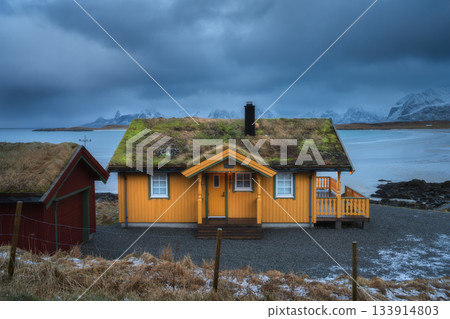 Traditional yellow rorbu with grass roof. Lofoten Island, Norway Traditional yellow rorbu with grass roof. Lofoten Island, Norway 133914803