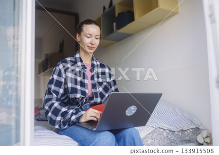 Person employs stylus to creatively alter visual material Person employs stylus to creatively alter visual material 133915508