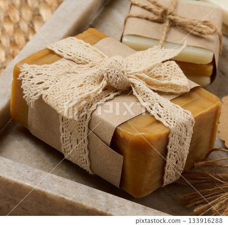 Handmade soap bars on marble stand, close up Handmade soap bars on marble stand, close up 133916288