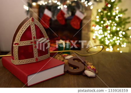 Festive Saint Nicholas Scene. Traditional Saint Nicholas symbols with gifts, Festive Saint Nicholas Scene. Traditional Saint Nicholas symbols with gifts, 133916359