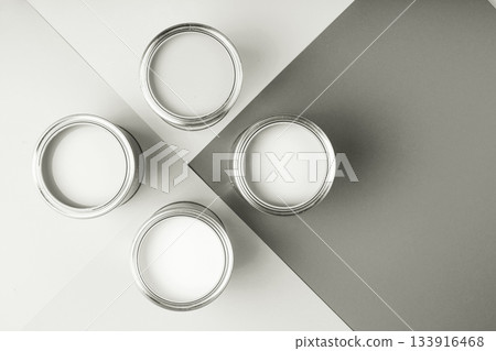 White paint cans on a gray geometric background. Color of 2026 year dancer in the white cloud White paint cans on a gray geometric background. Color of 2026 year dancer in the white cloud 133916468