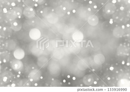Blurred background with silver festive lights. Perfect Christmas background. Blurred background with silver festive lights. Perfect Christmas background. 133916990