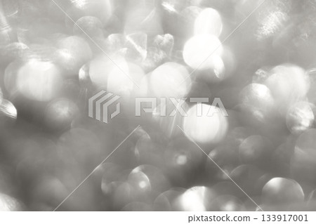 Soft abstract bokeh glow with silver tones, dreamy light texture. Demonstration Color of the Year 2026 133917001