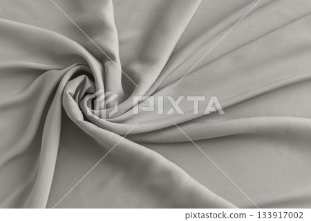 Soft gray fabric swirls in smooth drape and folds with calm, minimalist texture Demonstration Color of the Year 2026 Soft gray fabric swirls in smooth drape and folds with calm, minimalist texture Demonstration Color of the Year 2026 133917002