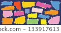 Colorful torn paper notes in various shapes taped to a dark background 133917613