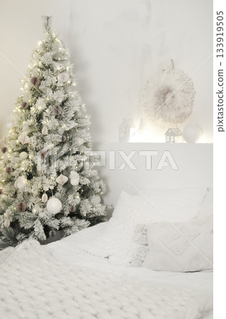Christmas tree decorating cozy white bedroom interior. Color of 2026 year dancer in the white cloud 133919505