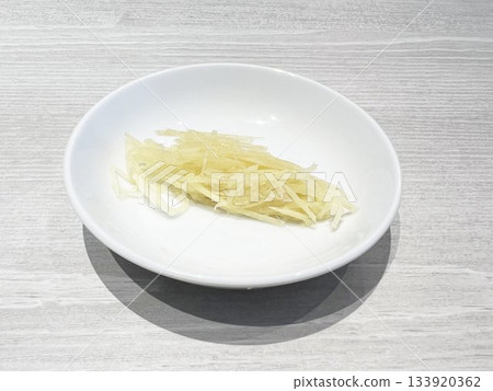 Ginger sticks on a small plate Ginger sticks on a small plate 133920362