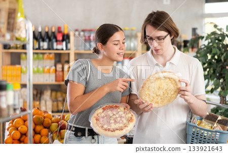 Couple young man and woman choosing pizza 133921643