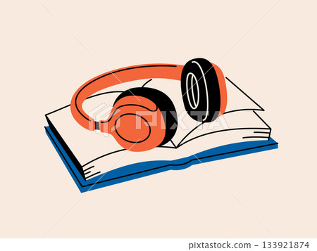 Headphones placed on top of a book 133921874
