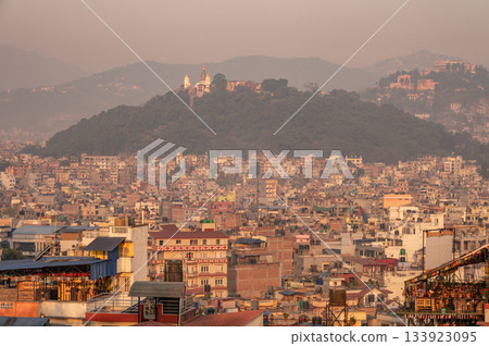 The cityscape of Kathmandu the capital city of Nepal during sunset. The city located in the bowl-shaped Kathmandu Valley of central Nepal. The cityscape of Kathmandu the capital city of Nepal during sunset. The city located in the bowl-shaped Kathmandu Valley of central Nepal. 133923095