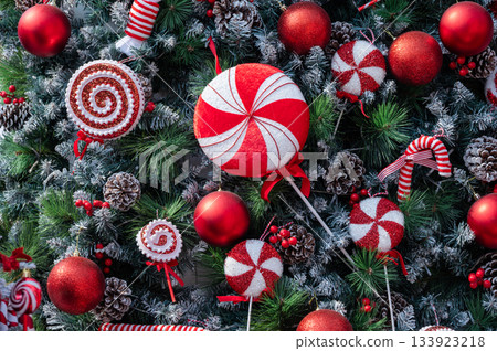 An ornaments decorated on Christmas tree during Christmas festival. Christmas tree, an evergreen tree, decorated with lights and ornaments as a part of Christmas festivities. An ornaments decorated on Christmas tree during Christmas festival. Christmas tree, an evergreen tree, decorated with lights and ornaments as a part of Christmas festivities. 133923218