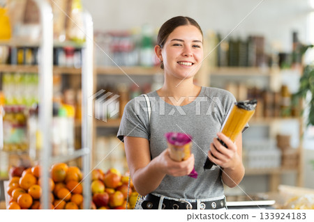 Woman choosing spaghetti Woman choosing spaghetti 133924183