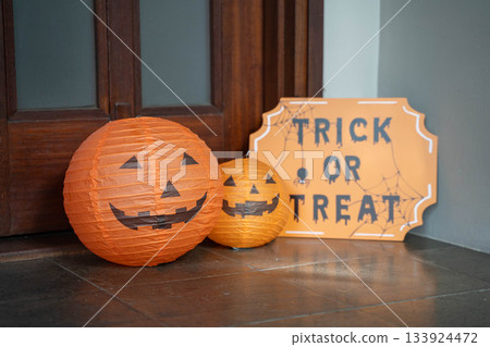 Halloween decorations and jack-o'-lantern ornaments/Trick or Treat signs and orange lanterns Halloween decorations and jack-o'-lantern ornaments/Trick or Treat signs and orange lanterns 133924472