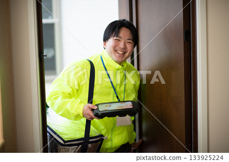 Lunch delivery person 133925224