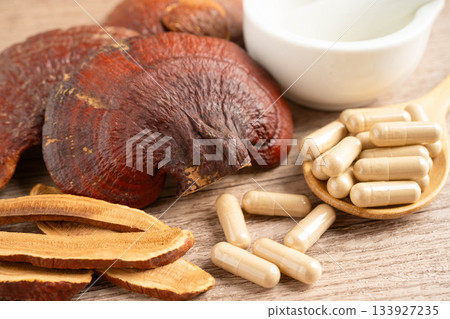 Lingzhi or Reishi mushroom with capsules, organic natural healthy food. 133927235