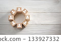 Wooden Blocks with Human Icons Arranged in Circular Shape on White Rustic Wooden Tabletop 133927332