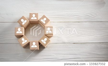 Wooden Blocks with Human Icons Arranged in Circular Shape on White Rustic Wooden Tabletop Wooden Blocks with Human Icons Arranged in Circular Shape on White Rustic Wooden Tabletop 133927332