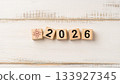 AI Technology Icon and Wooden Blocks Forming 2026 on Light Wooden Background Representing Artificial Intelligence Future 133927345