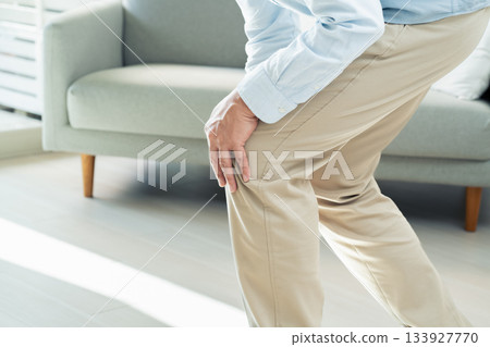 Senior man with knee pain Senior man with knee pain 133927770