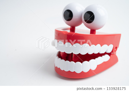 Funny red teeth with eye toy denture model for dental health care. Funny red teeth with eye toy denture model for dental health care. 133928175