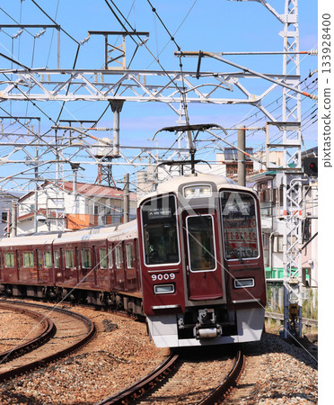 Hankyu Takarazuka Line 9000 series train running near Hattori Tenjin Station Hankyu Takarazuka Line 9000 series train running near Hattori Tenjin Station 133928400