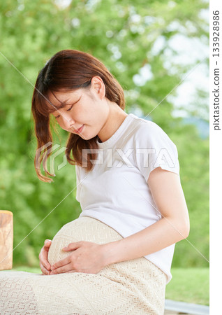 Pregnant woman park nature Pregnant woman park nature 133928986