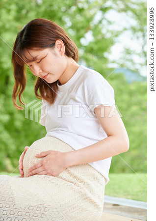 Pregnant woman park nature Pregnant woman park nature 133928996